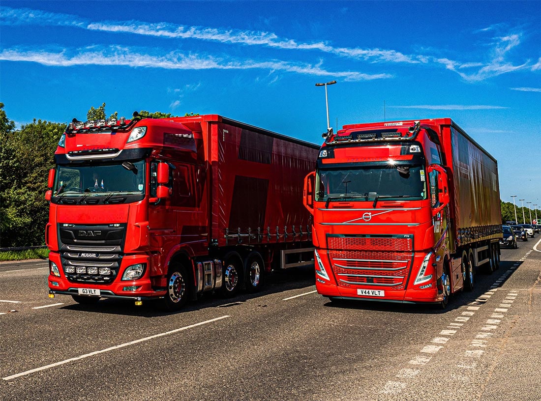VLT trucks side by side on road